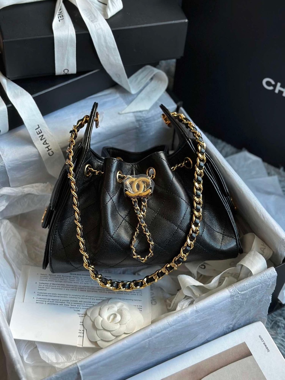 CHANEL Black Quilted Leather Drawstring Bucket Bag with Gold Chain
